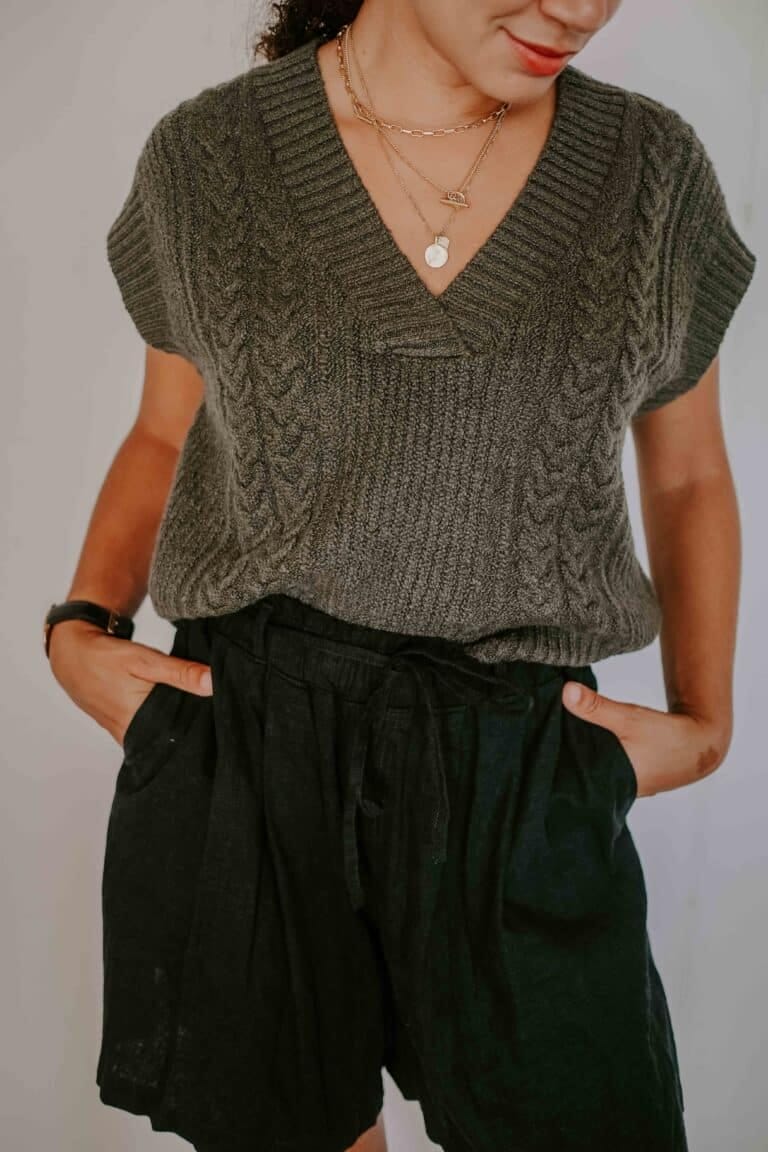 green cable knit sweater and shorts outfit