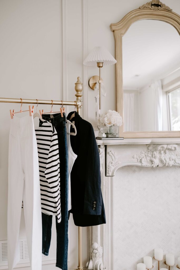 Capsule wardrobe hanging on sales rack.